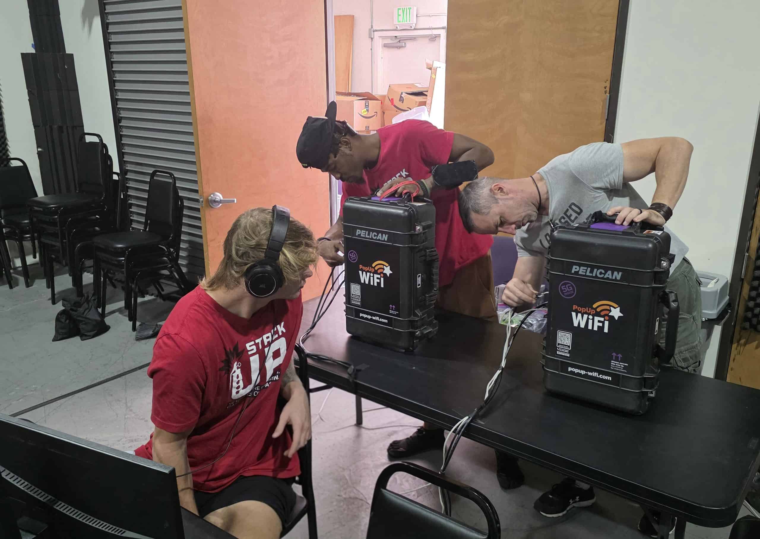 Live streamers set up event internet rental from PopUp WiFi by plugging in ethernet cords.
