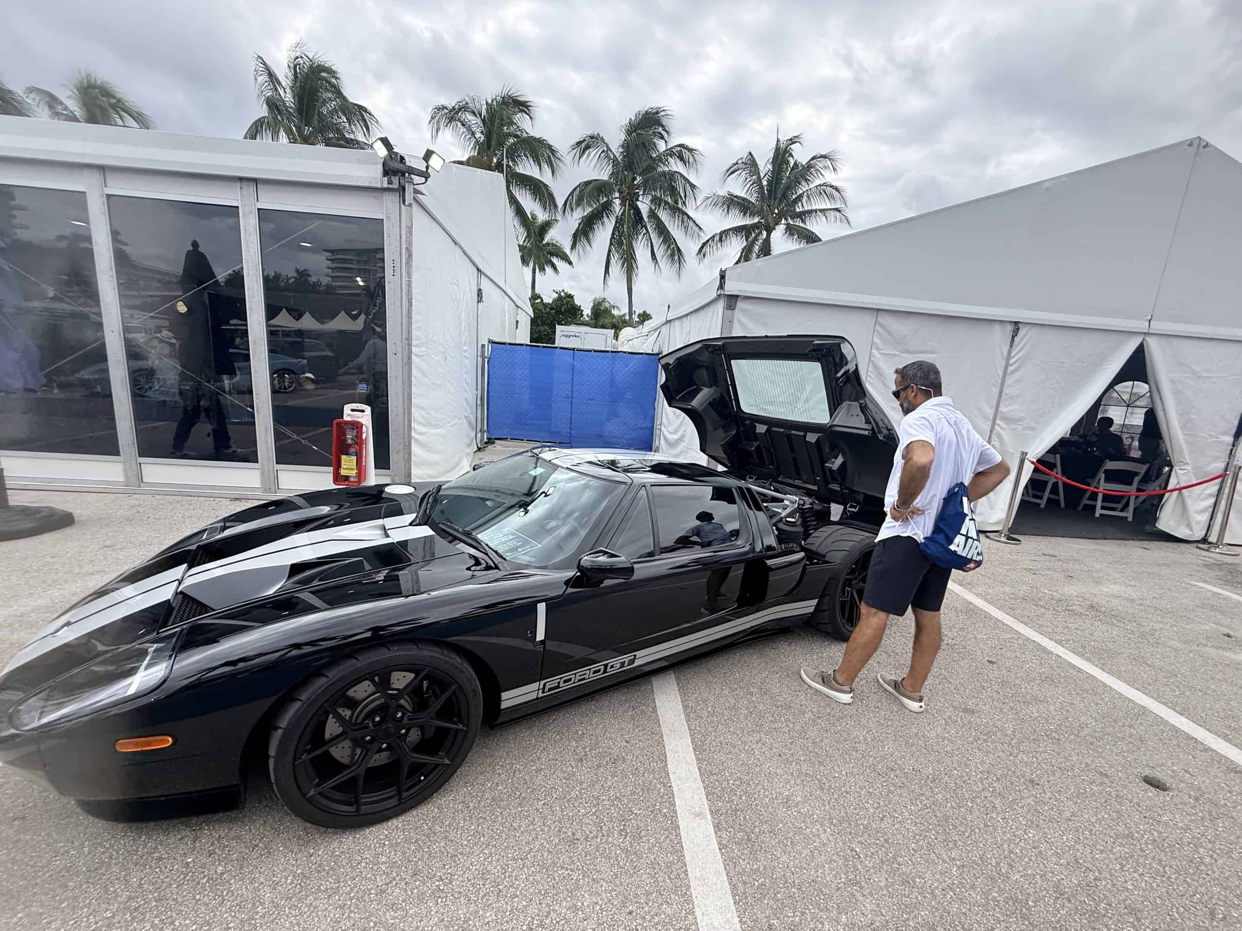 Guests checking out the supercars at FLIP which chose to rent the best event internet in Florida from PopUp WiFi.
