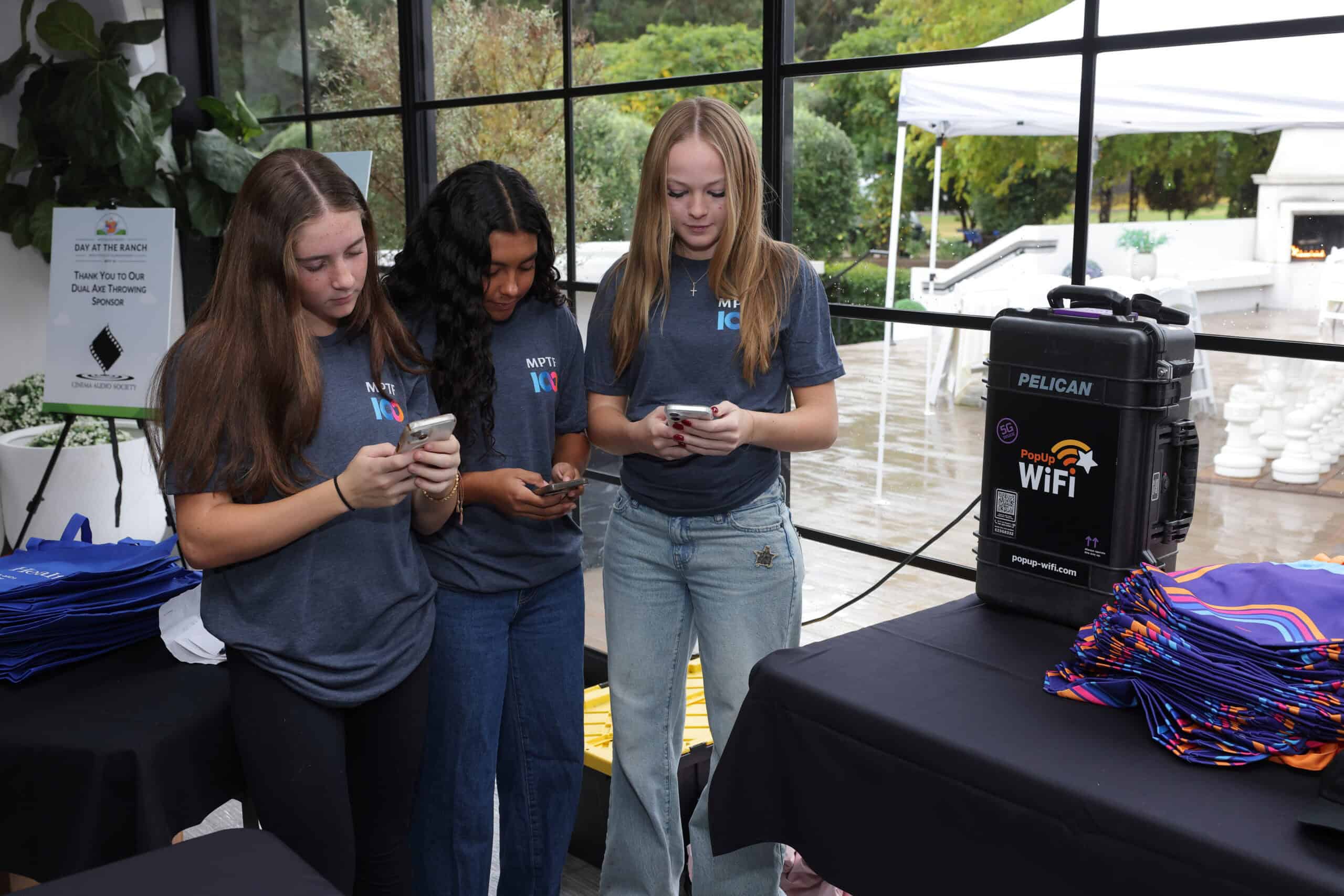 Volunteers connecting their event with event internet for rent in California from PopUp WiFi