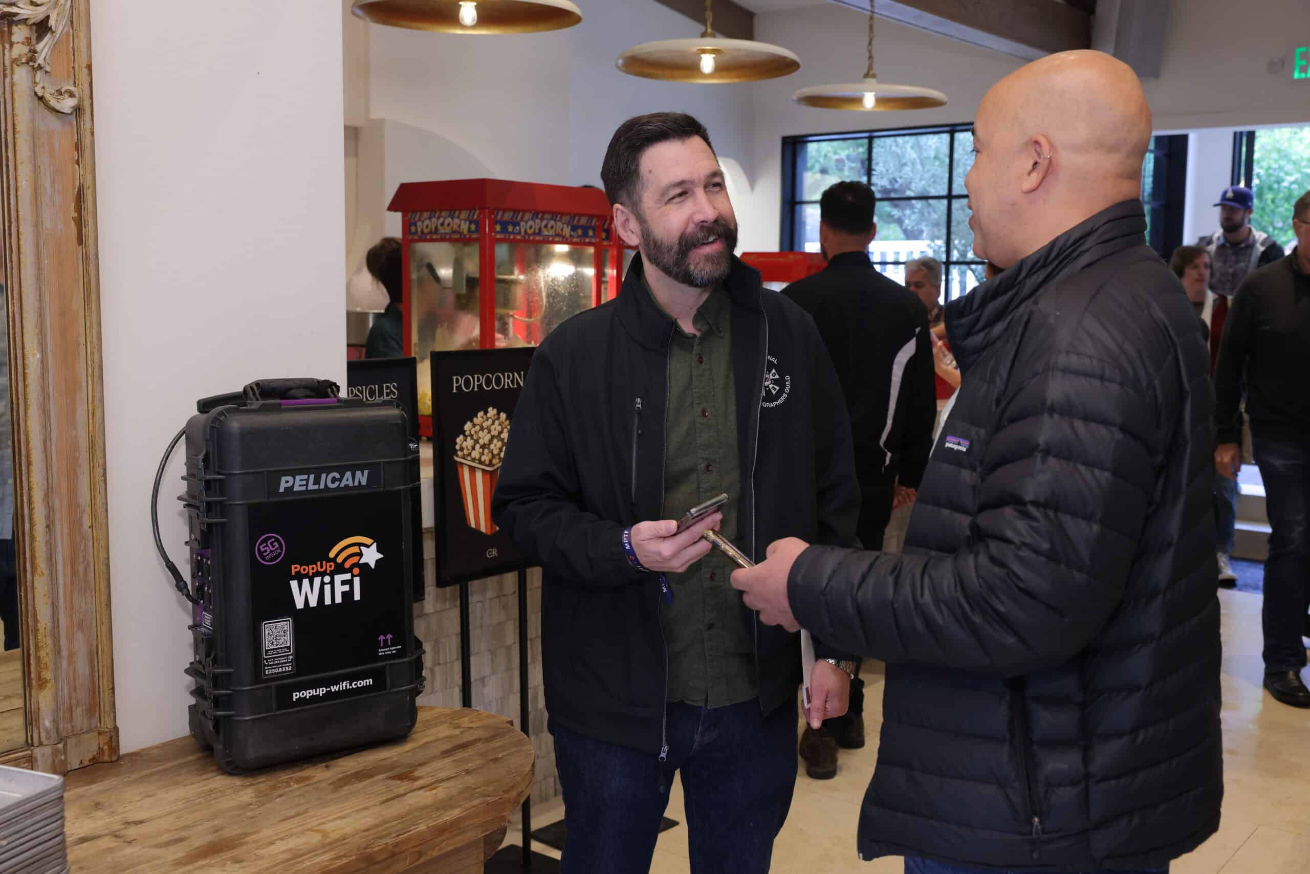 Attendees networking with devices connecting to guest WiFi rental from PopUp WiFi