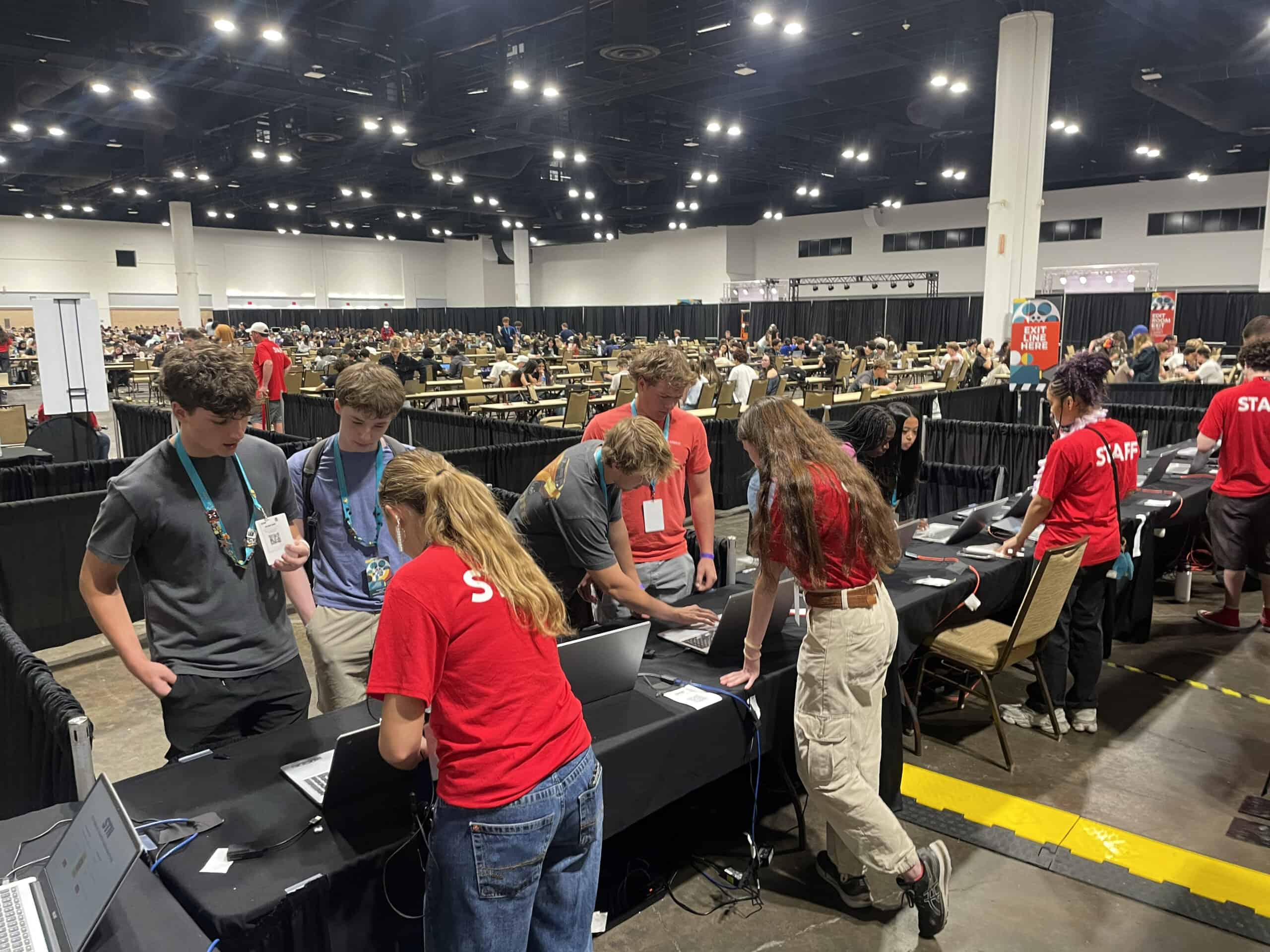 Students uploading media files using reliable conference internet at STN convention