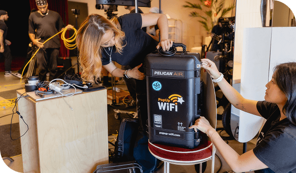 Event producers setting up the PopUp WiFi Titan for a live streaming event