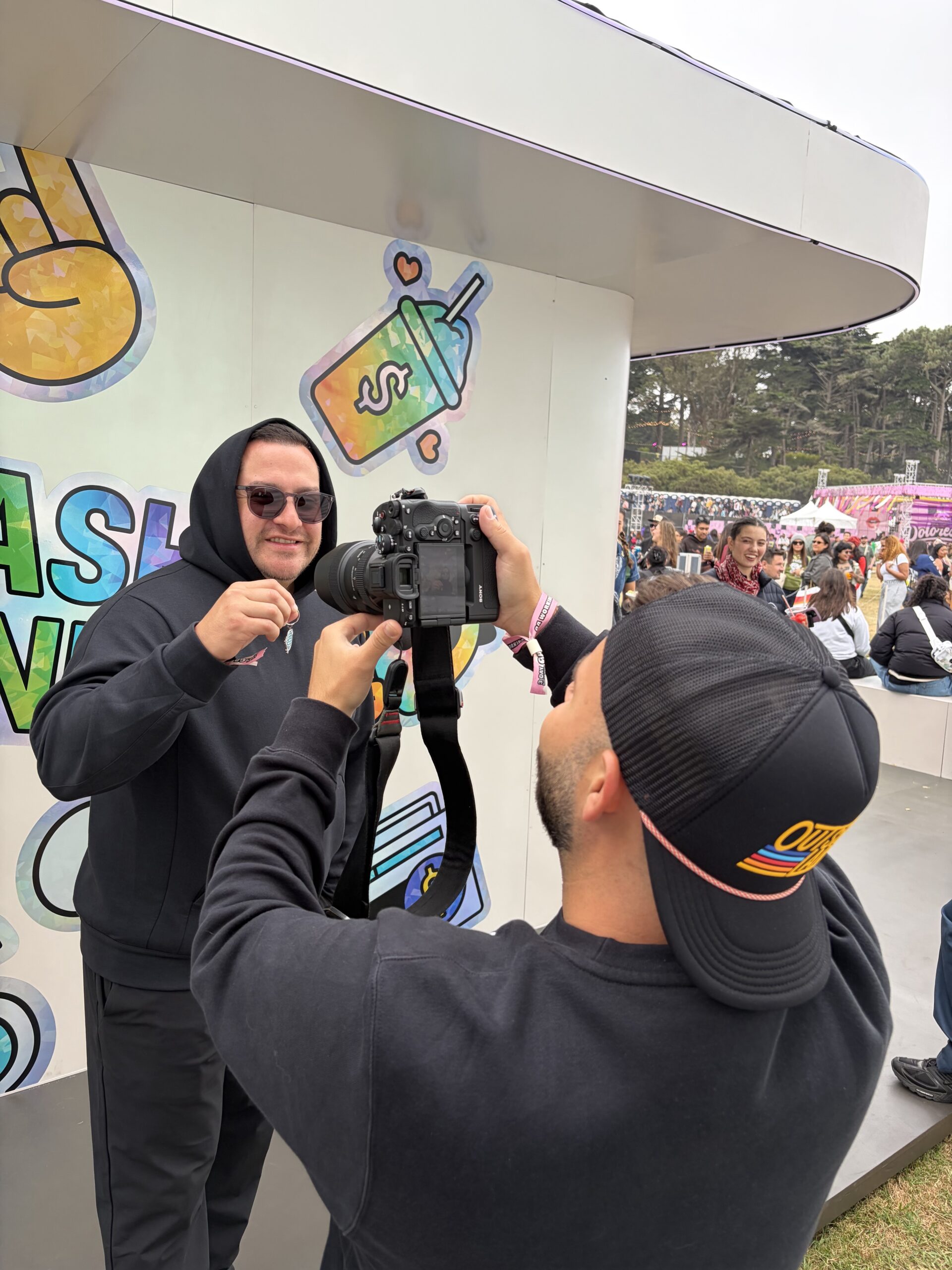 Attendee at Golden Gate Park San Francisco being photographed with internet provided b PopUp WiFi for media uploads.