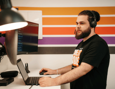 PopUp WiFi Network Engineer monitoring event networks wearing a headset.