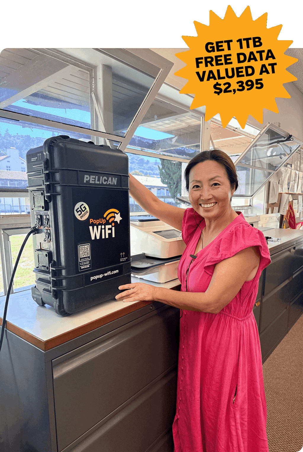 Woman smiling with PopUp WiFi unit